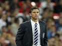 Welsh manager Gary Speed watches his team play against England in their 2012 Group G Euro Qualifier football match at Wembley stadium in London, on September 6, 2011