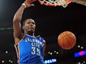 Kevin Durant of the Oklahoma City Thunder scores off a slam dunk against the Los Angeles Lakers during their NBA game at Staples Center on February 13, 2014