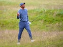 Tiger Woods plays a shot during the first round of The 144th Open at St Andrews on July 16, 2015