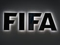 A photo shows the FIFA sign at the entrance of the world football's governing body headquarters in Zurich taken on September 25, 2015
