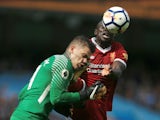 Ederson collides with Sadio Mane during the Premier League game between Manchester City and Liverpool on September 9, 2017