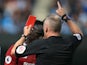 Jon Moss hands Sadio Mane a red card during the Premier League game between Manchester City and Liverpool on September 9, 2017