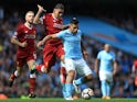 Roberto Firmino battles with Sergio Aguero during the Premier League game between Manchester City and Liverpool on September 9, 2017