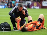 Tom Heaton receives treatment after going down injured during the Premier League game between Burnley and Crystal Palace on September 10, 2017