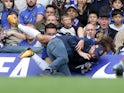 David Luiz takes out a photographer during the Premier League game between Chelsea and Arsenal on September 17, 2017