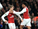Arsenal pair Nacho Monreal and Alex Iwobi celebrate during their side's EFL Cup semi-final with Chelsea at the Emirates Stadium on January 24, 2018