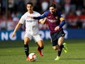 Barcelona's Lionel Messi in action with Sevilla's Wissam Ben Yedder during their La Liga clash on February 23, 2019