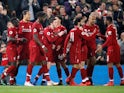 Liverpool players celebrate after scoring against Watford in the Premier League on February 27, 2019