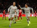 Virgil van Dijk celebrates with Roberto Firmino after scoring Liverpool's second goal against Bayern Munich on March 13, 2019