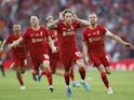 Liverpool's Kostas Tsimikas celebrates after scoring the winning penalty in the shoot-out on May 14, 2022
