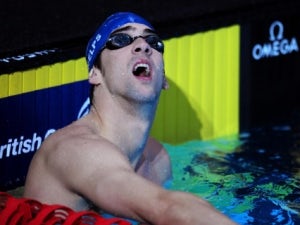 Phelps celebrates birthday by beating Lochte