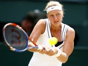 Kvitova breezes into last eight