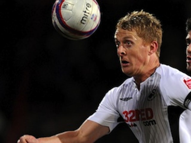 Swansea captain Monk signs new deal