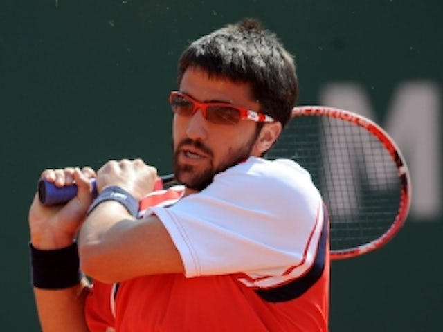 Classy Tipsarevic sees off Sweeting