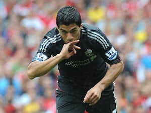 Suarez charged by FA over alleged racist incident