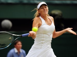 Sharapova sees off Clijsters in quarters