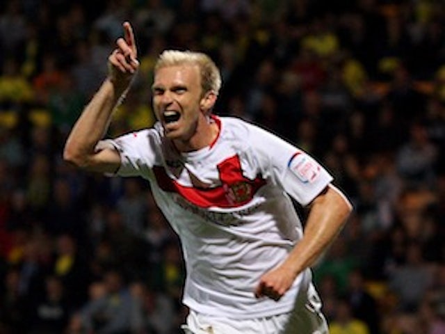League One roundup: MK Dons thrash Colchester