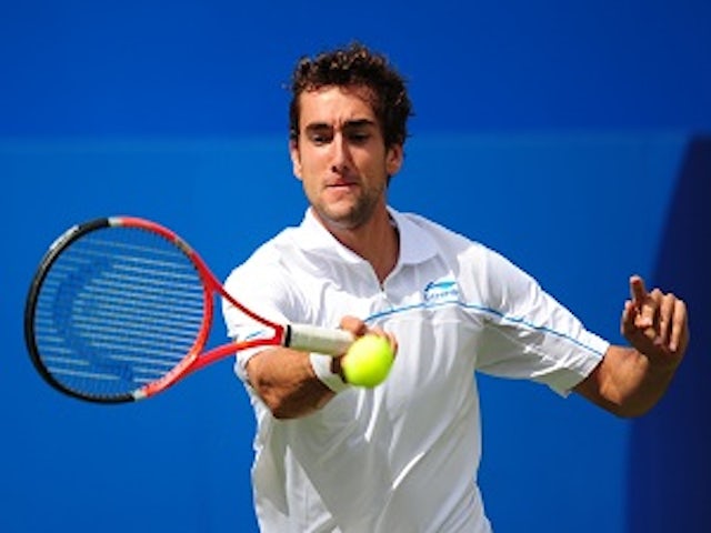 Cilic edges out Isner
