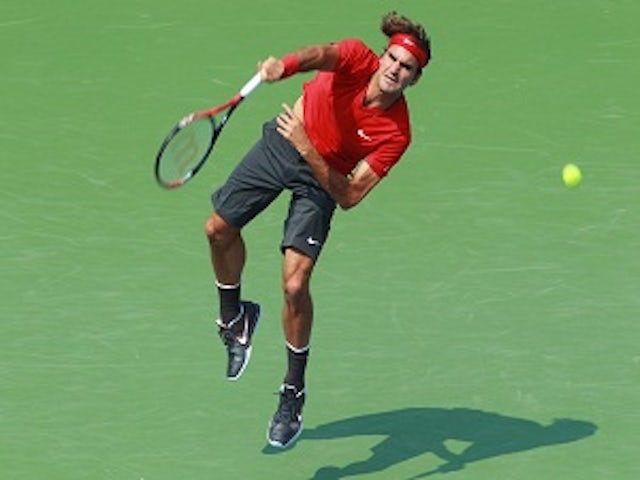 Federer ousts Isner