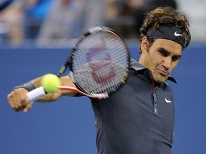 Federer blasts through to second round