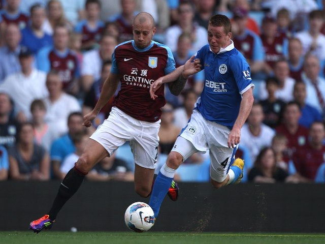 Villa defend Hutton over criticism
