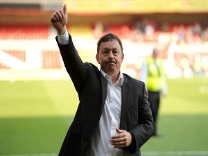 Davies plays down promotion