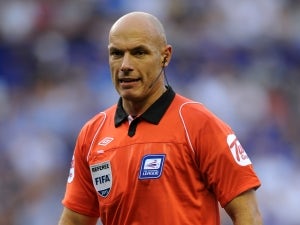 Referee Webb halts troubled Euro qualifier