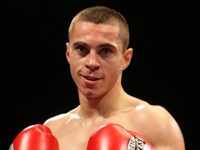 Quigg defeats Booth to claim title