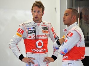 Button determined to take Hamilton's lead