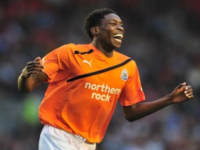 Two arrested over Ameobi racism claim