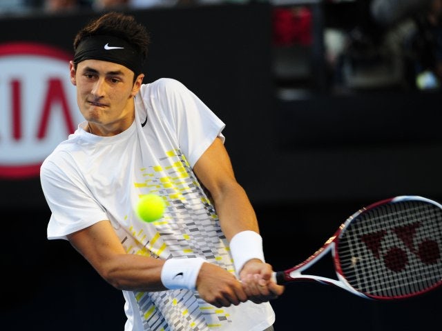 Tomic plays down father rift