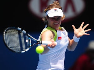 Clijsters safely through to round three