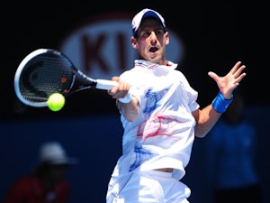 Djokovic reaches last eight