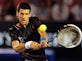 Djokovic battles past Starace