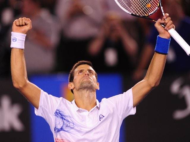 Djokovic battles into quarter-finals