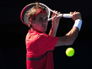 Federer advances in Dubai
