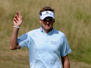 At the turn: Poulter all sqaure with Simpson