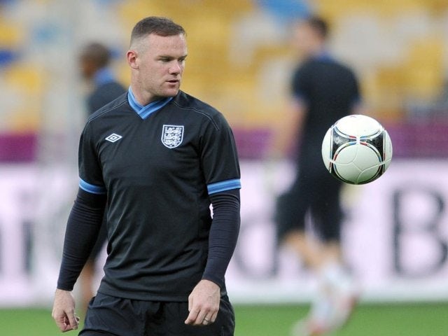 Rooney expects tough Italy test