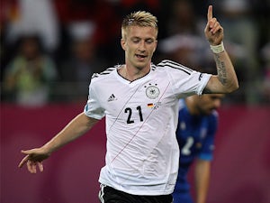 Reus double hands Germany first-half lead