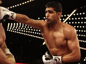 Khan lends support to Muamba