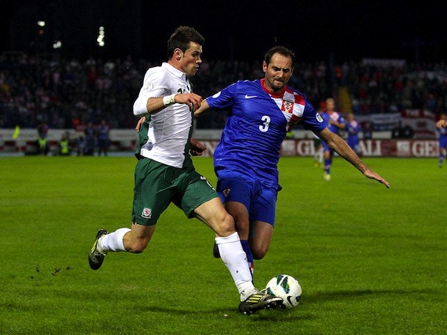 Josip Simunic of Croatia and Gareth Bale of Wales
