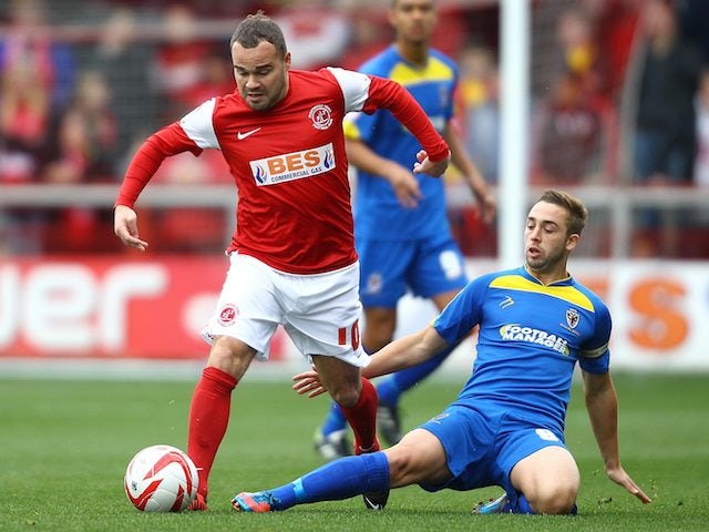 Fleetwood Town's Lee Fowler and AFC Wimbledon's Sammy Moore