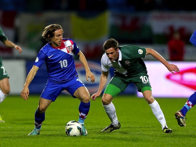 Luka Modric of Croatia and Andy King of Wales