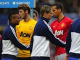 Ashley Cole and Rio Ferdinand shake hands before the game