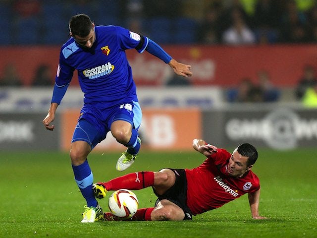 Daniel Pudil is tackled by Don Cowie