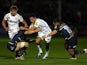 Sale's Rob Miller is tackled by Worcester's Matt Kvesic and Ed Shervington