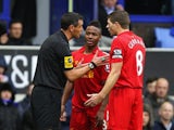 Steven Gerrard mediates as Raheem Sterling is told off by the ref