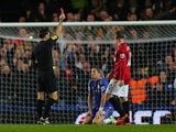 Fernando Torres is shown a red card