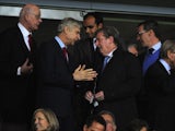 Arsene Wenger having a laugh in the stands with Roy Hodgson