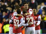 Arsenal players celebrate their 7-5 victory over Reading